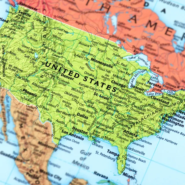 Close-up of a colorful map featuring the central and southern United States, highlighting major cities like Houston, Denver, and Miami.