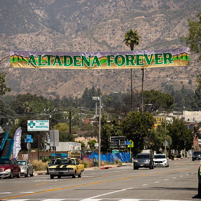 Banner displaying the text “Alameda Forever” in bold letters against a colorful background.
