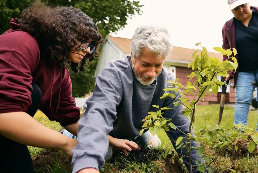 family planting a tree