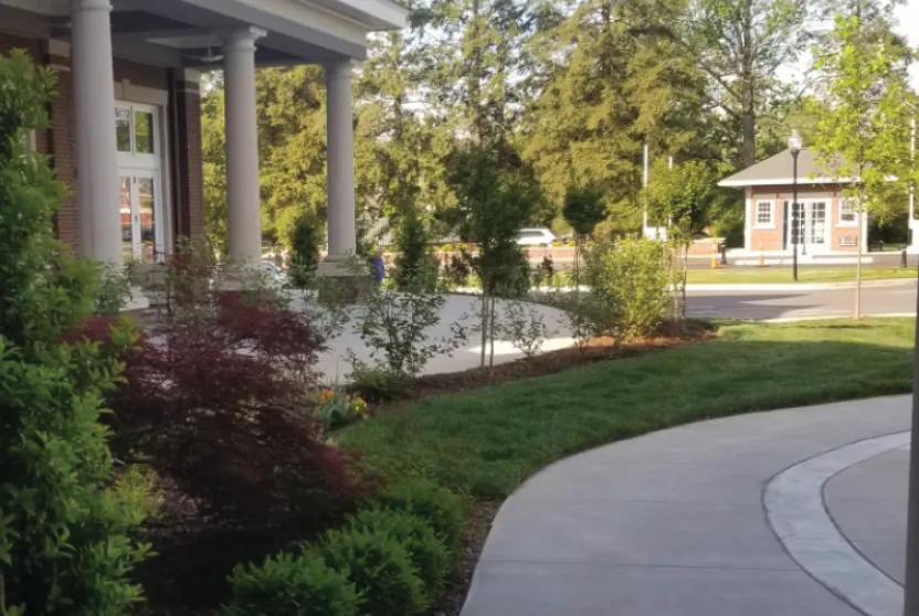 Front entrance of a Masonic Homes Kentucky, Louisville Campus showcasing a well-landscaped exterior.